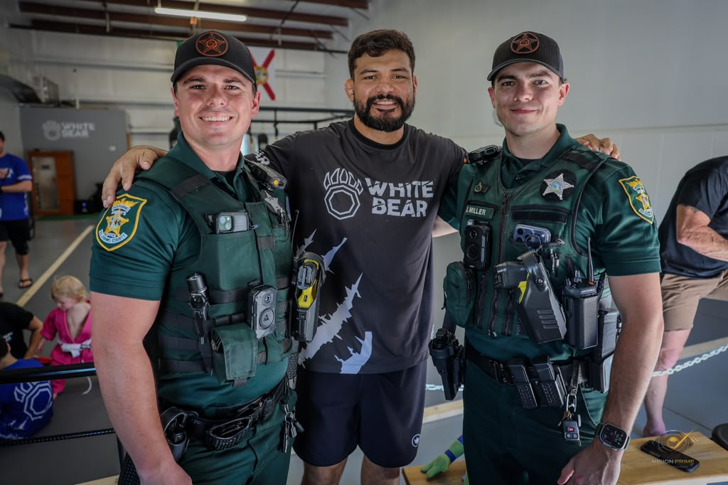 Coach Klidson with St. Johns County sheriff deputies at White Bear MMA